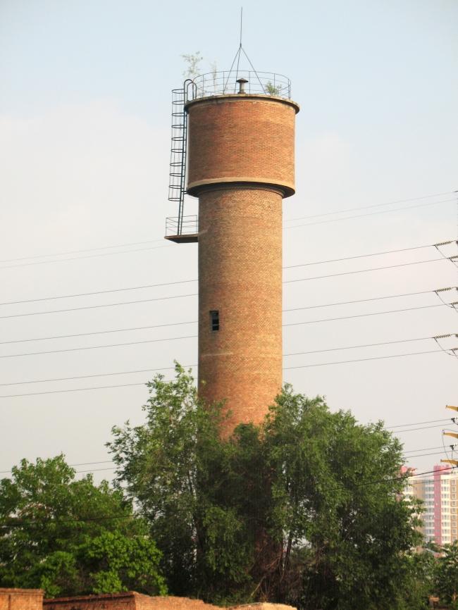 常见于一些老工业区的上面是圆锥下面是圆柱的塔形建筑物是什么