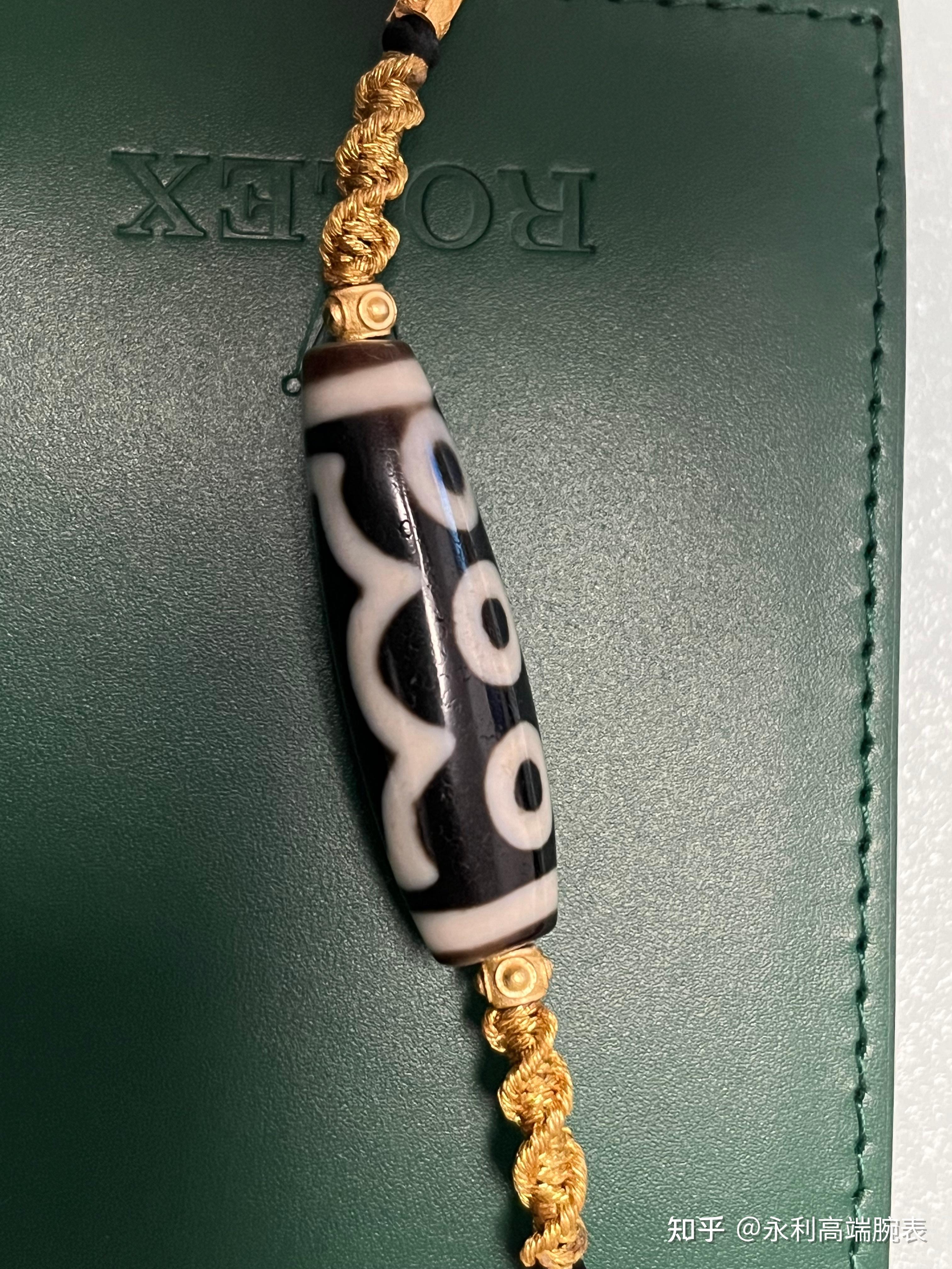 宝盖五眼天珠!接近博古级别!咬色扎实清晰,钙化自然,纯手工,尺寸39.8×13mm,超级漏价分享,带鉴定证书 - 知乎
