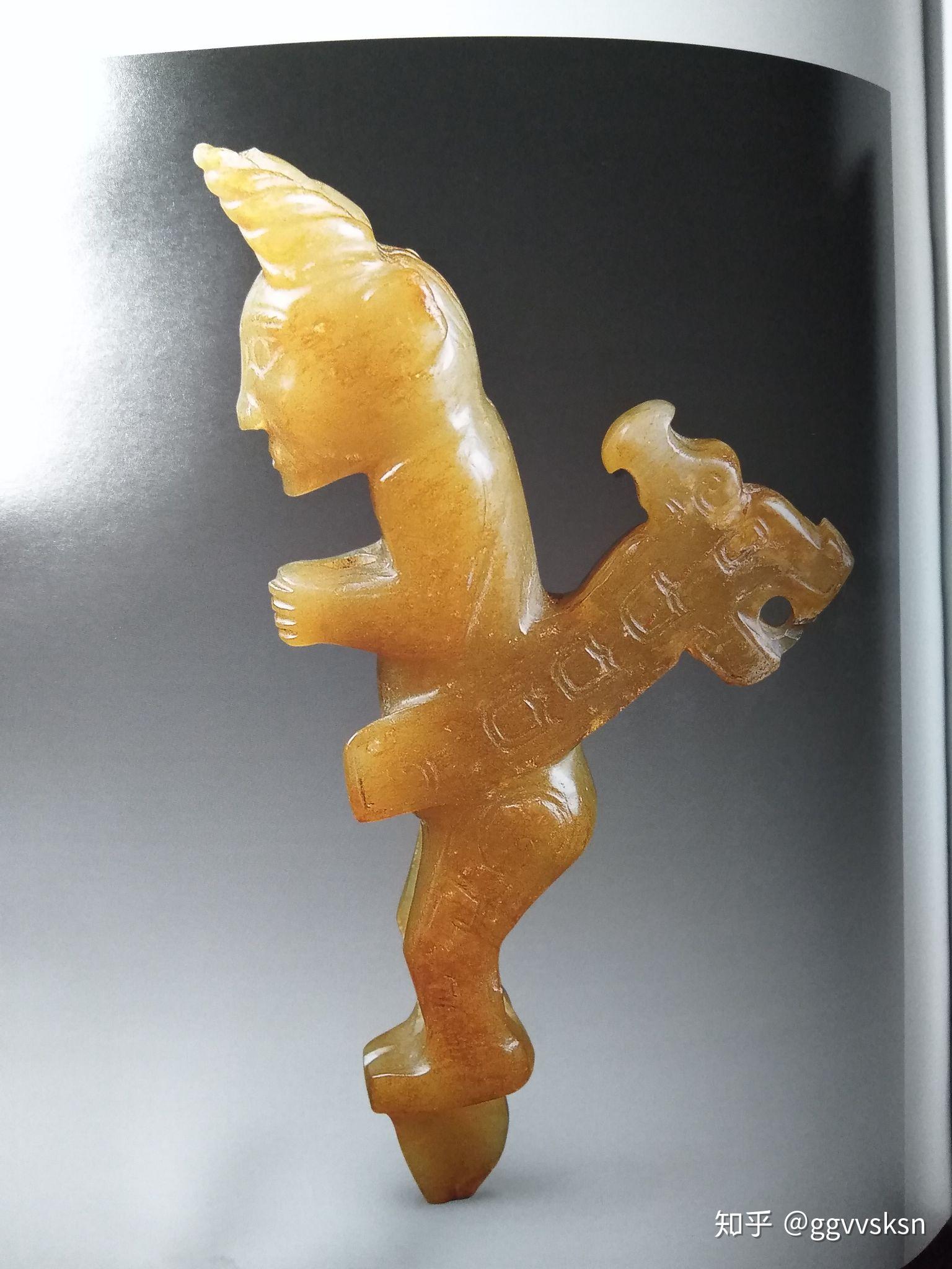 妇好墓出土的商代圆雕跽坐玉人背后的发条状物是做什么用的